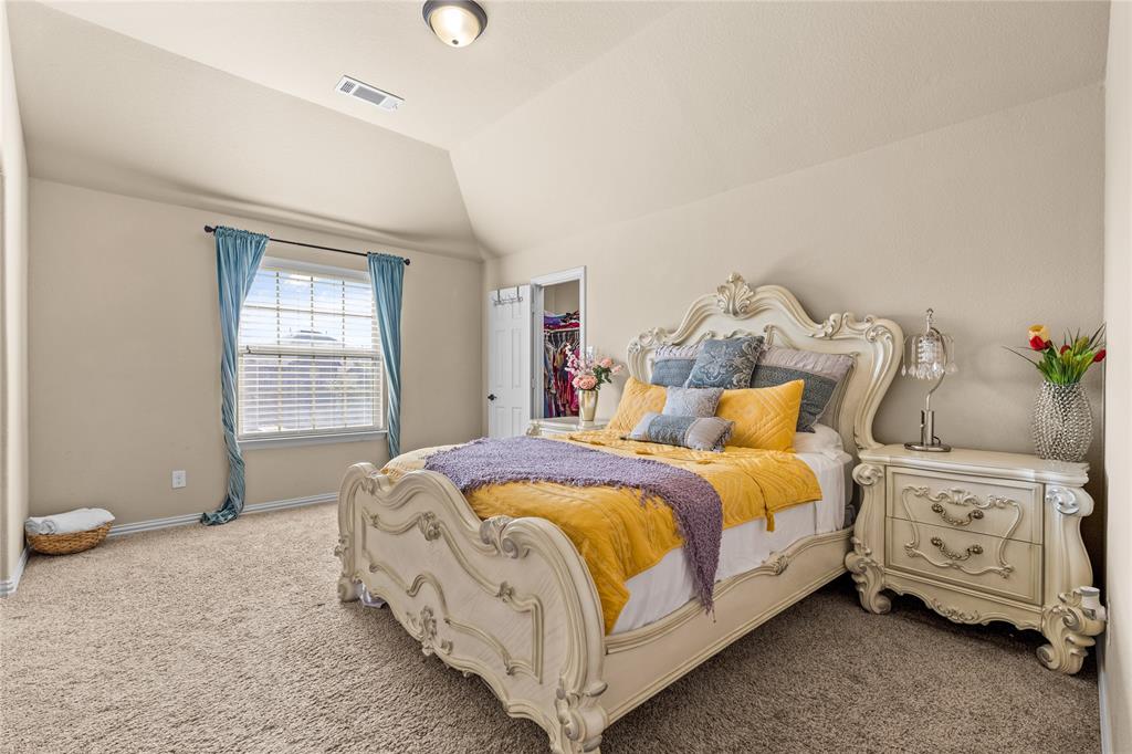 9801 Nolina Road Fort Worth, TX 76177 - Photo 28 of 40 a bed room with a bed and a chair