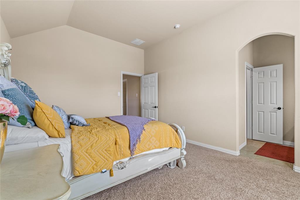9801 Nolina Road Fort Worth, TX 76177 - Photo 29 of 40 a bedroom with a bed and a painting on the wall