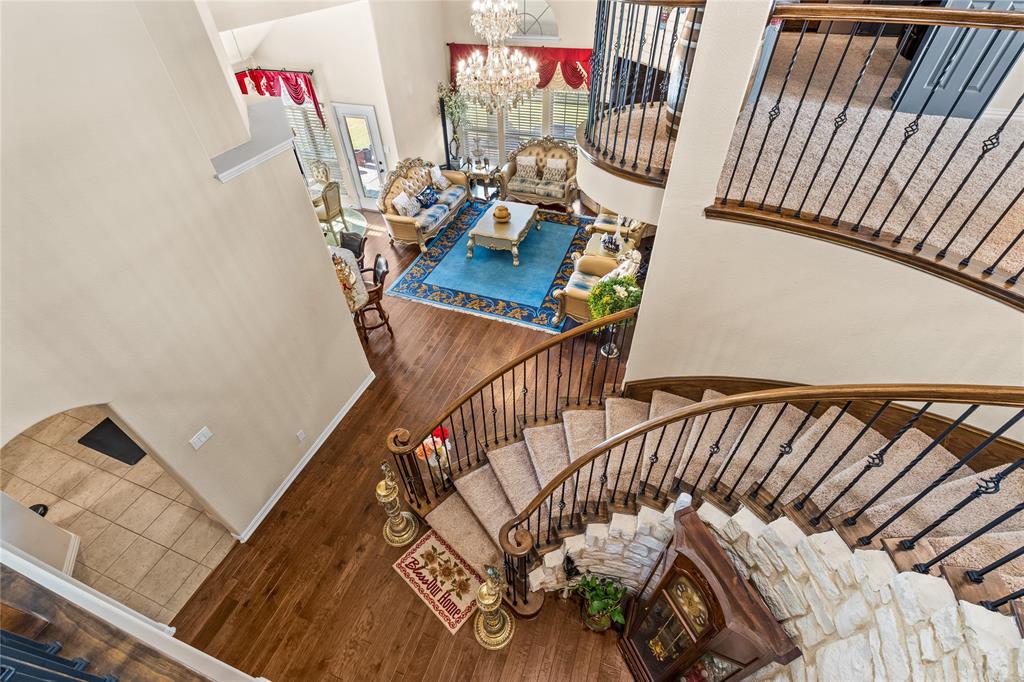 9801 Nolina Road Fort Worth, TX 76177 - Photo 31 of 40 a view of stairs and a living room with furniture