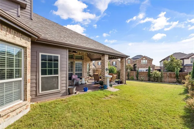 a view of a house with sitting area and garden