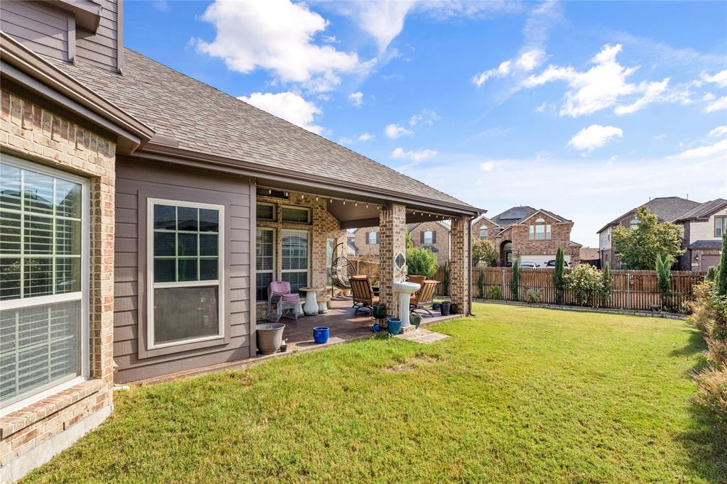 9801 Nolina Road Fort Worth, TX 76177 - Photo 34 of 40 a view of a house with sitting area and garden
