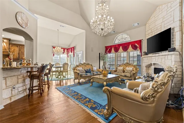 a living room with fireplace furniture and a flat screen tv