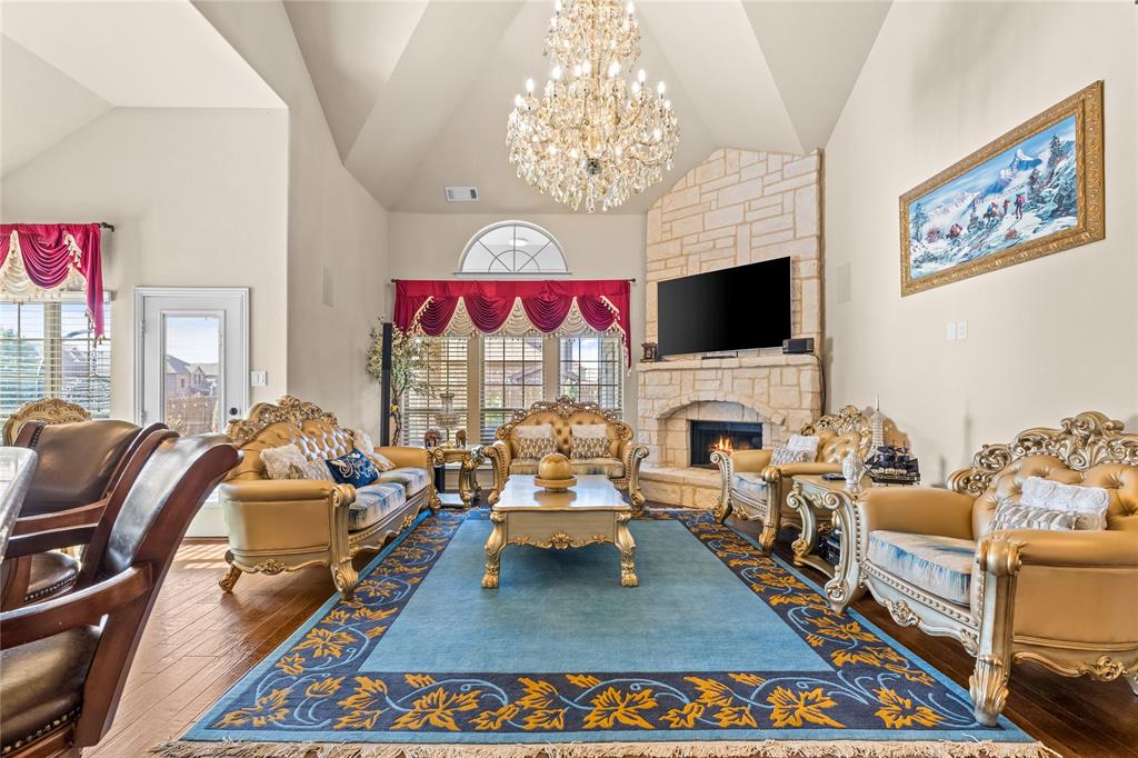 9801 Nolina Road Fort Worth, TX 76177 - Photo 9 of 40 a living room with furniture a flat screen tv and a fireplace