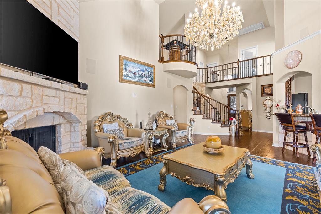 9801 Nolina Road Fort Worth, TX 76177 - Photo 10 of 40 a living room with furniture a flat screen tv and a fireplace