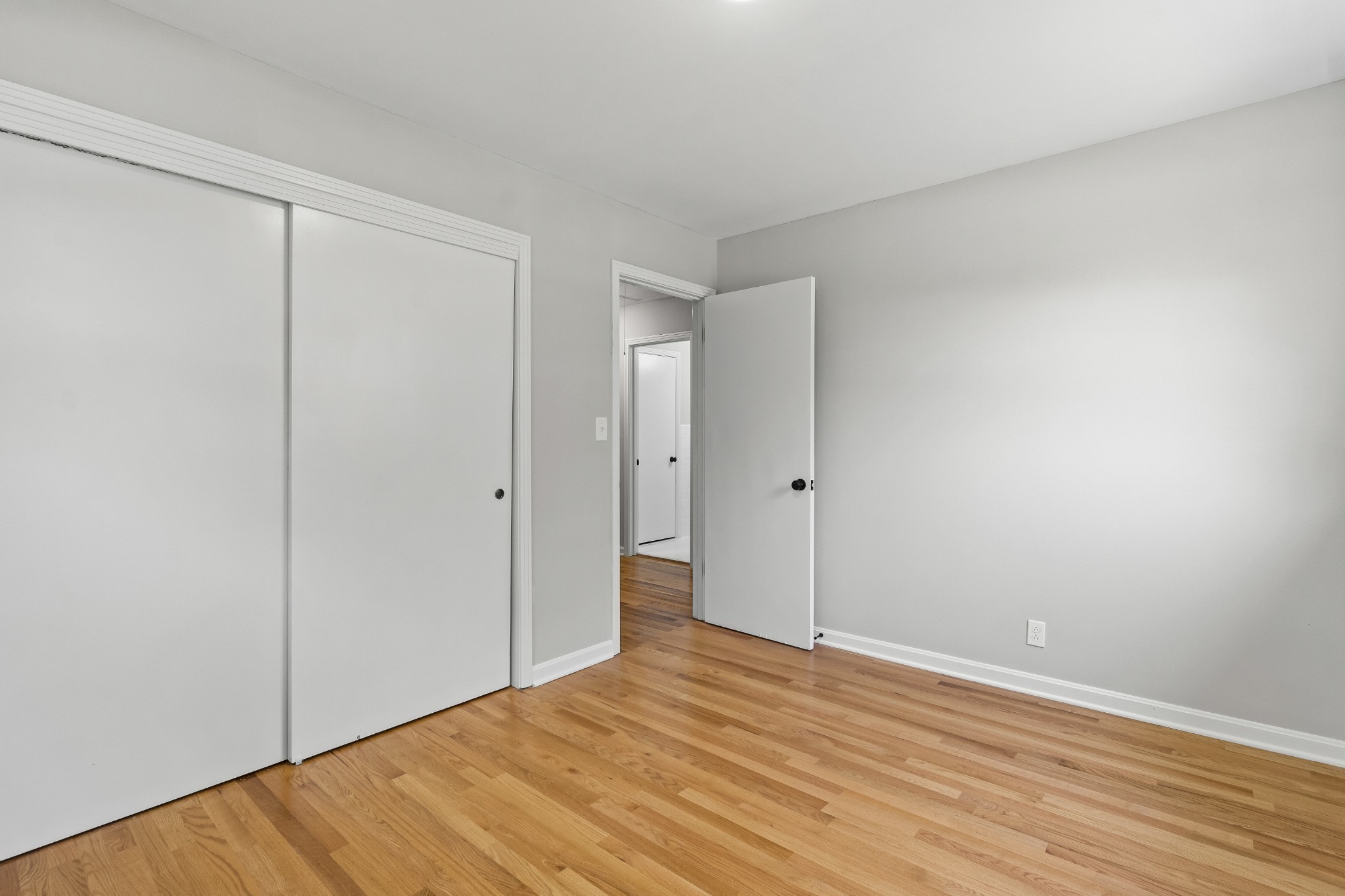 3822 Vernon Creek Road Cunningham, TN 37052 - Photo 12 of 24 a view of an empty room with wooden floor