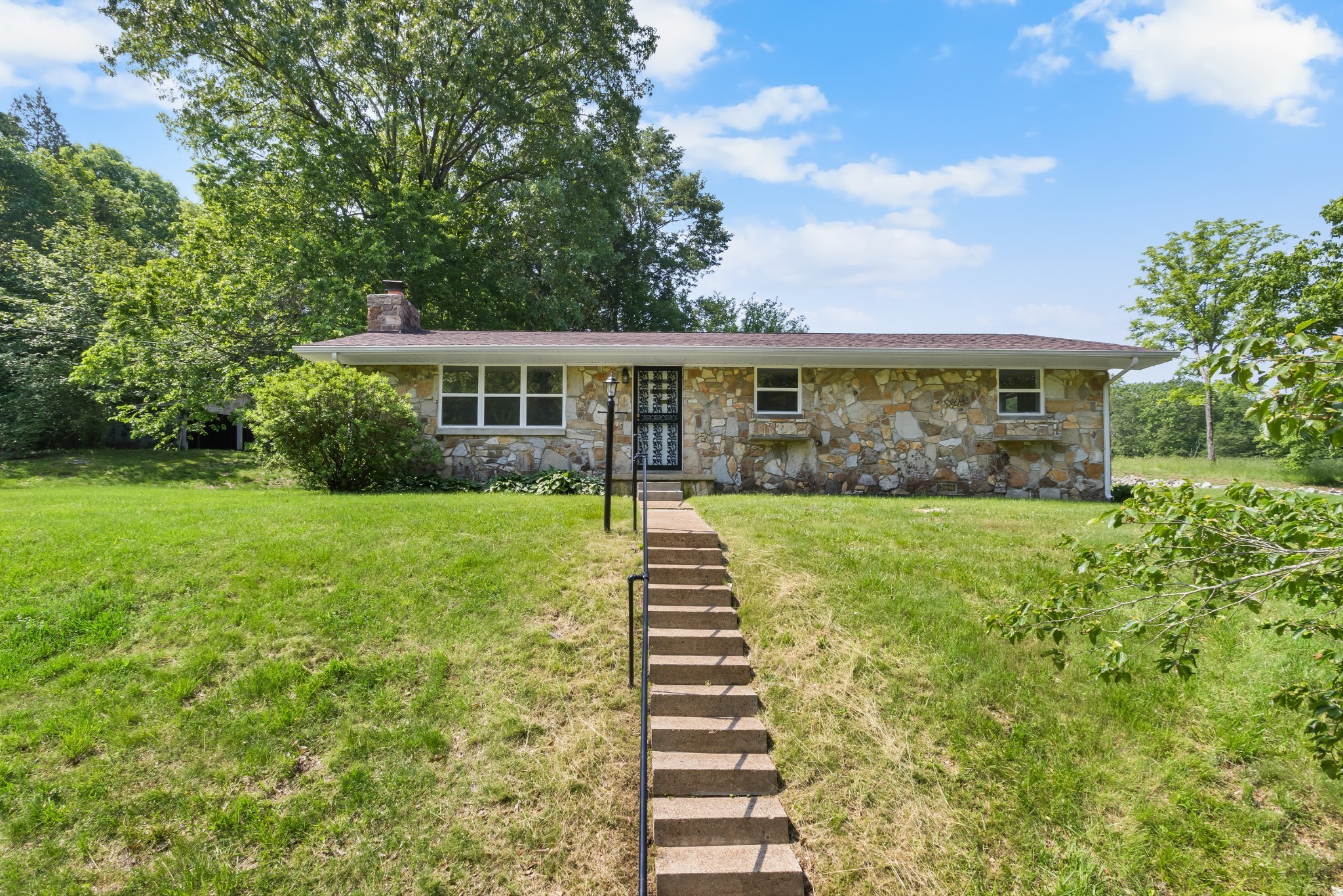 3822 Vernon Creek Road Cunningham, TN 37052 - Photo 2 of 24 a front view of a house with a yard