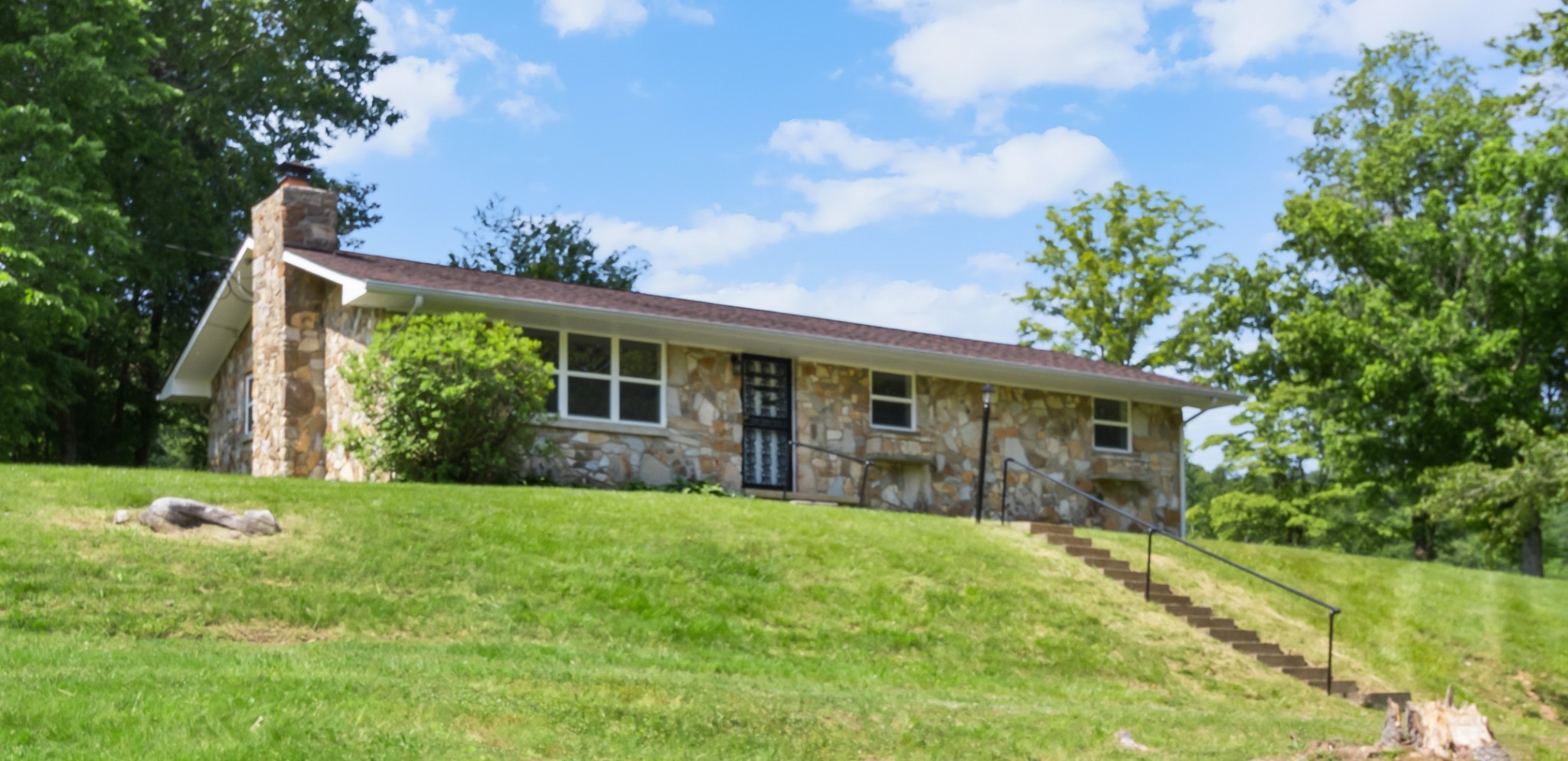 3822 Vernon Creek Road Cunningham, TN 37052 - Photo 21 of 24 a view of a house with a yard and sitting area