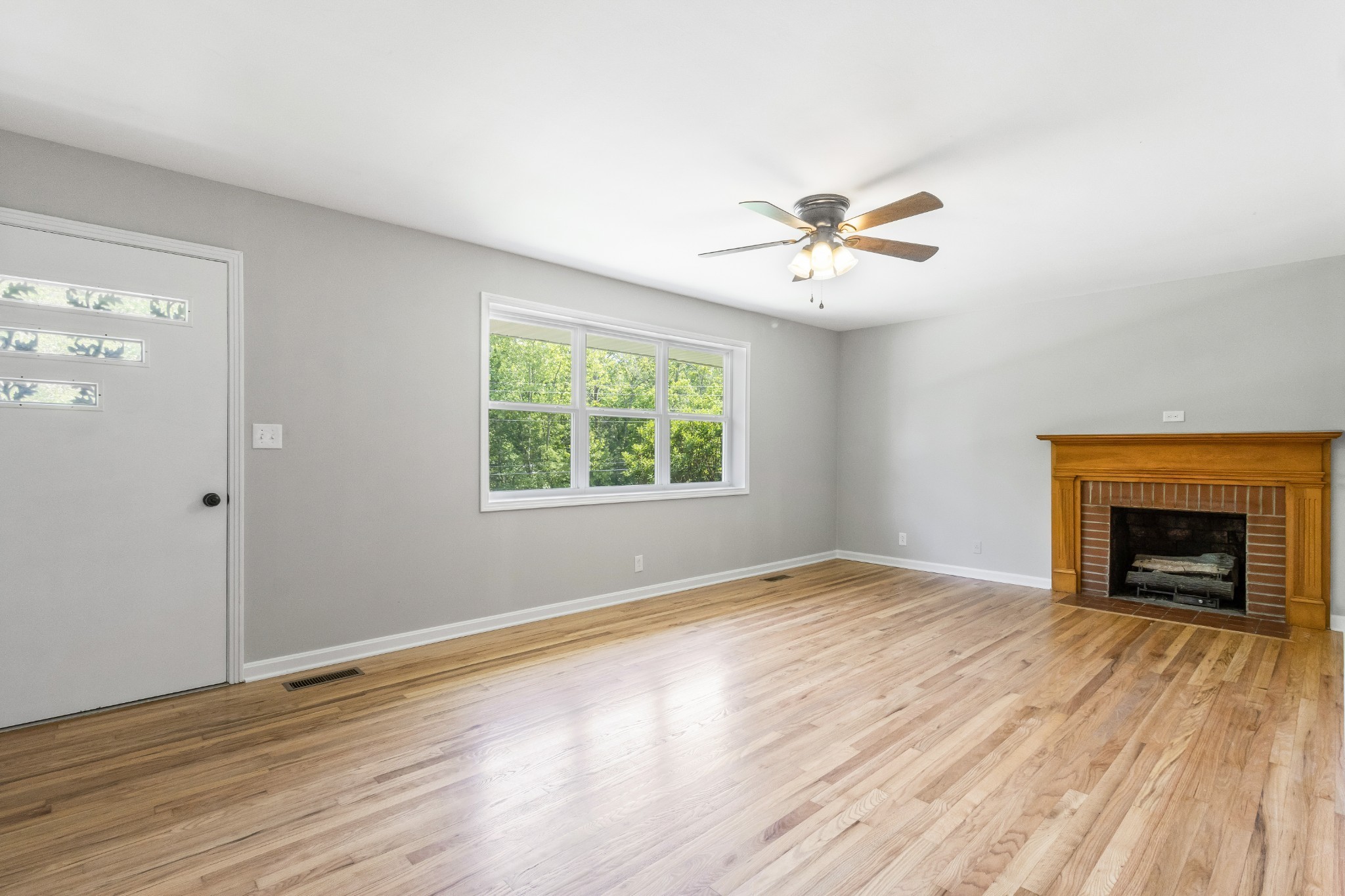 3822 Vernon Creek Road Cunningham, TN 37052 - Photo 5 of 24 an empty room with windows and a fireplace