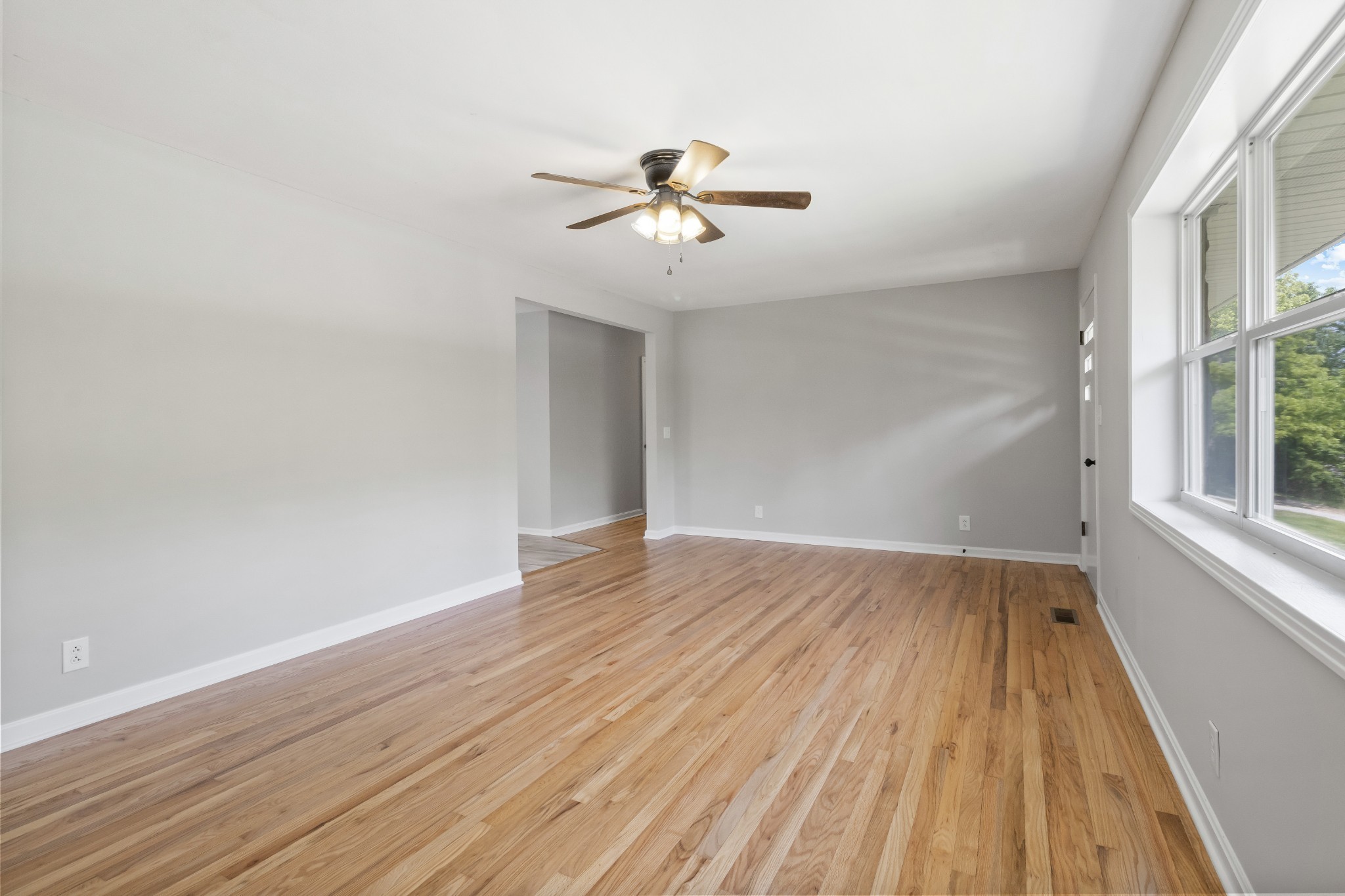 3822 Vernon Creek Road Cunningham, TN 37052 - Photo 6 of 24 wooden floor in an empty room with a window