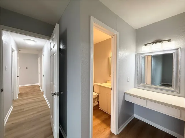 a view of a bedroom from a hallway