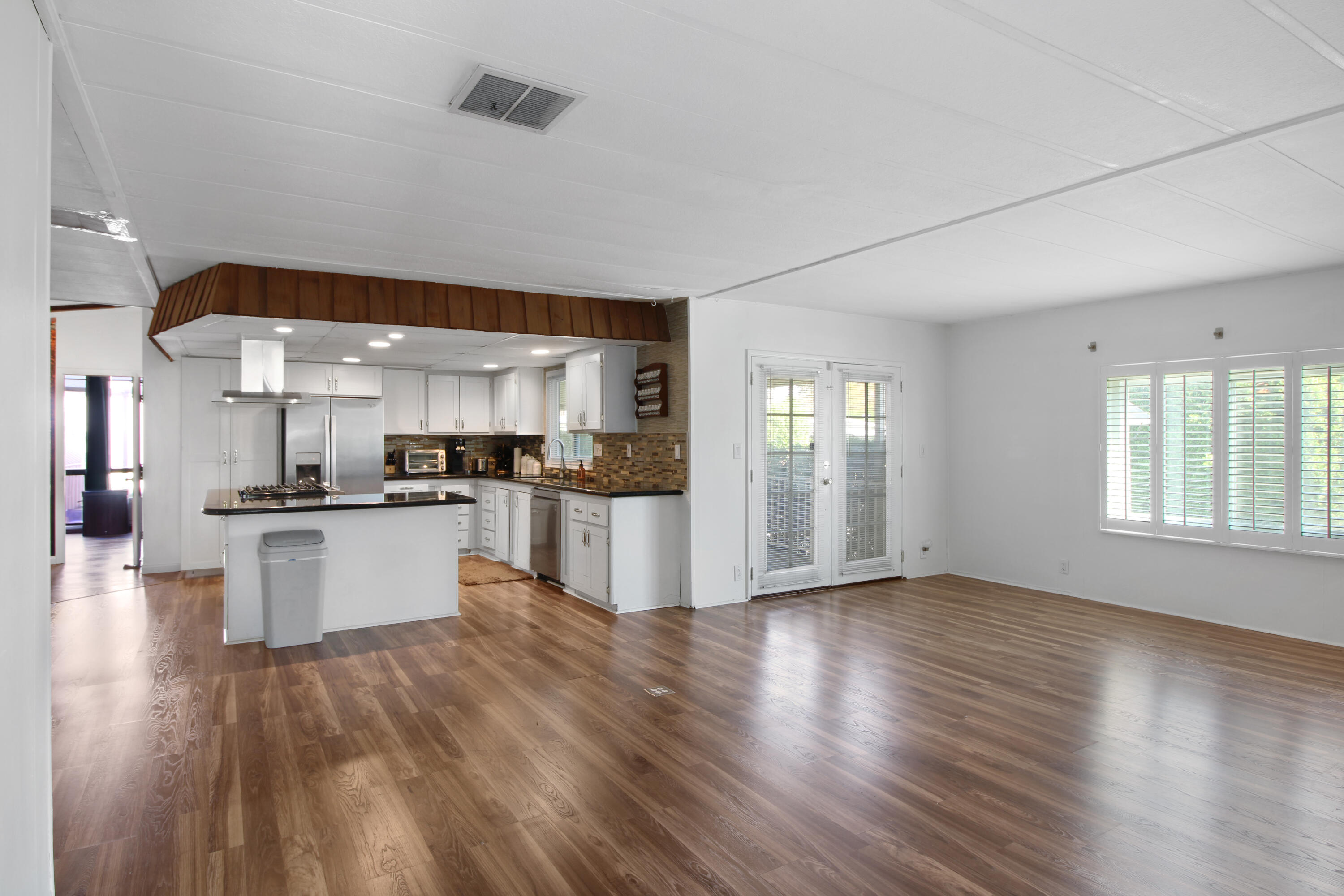 70 Golden State Street Rancho Mirage, CA 92270 - Photo 6 of 20 The Living Room is Open to the Kitchen