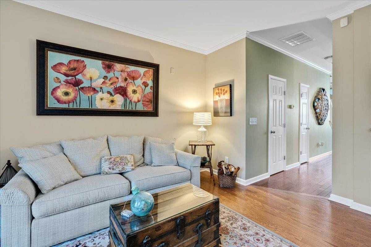 2924 Casona Way Raleigh, NC 27616 - Photo 12 of 21 a living room with furniture and wooden floor