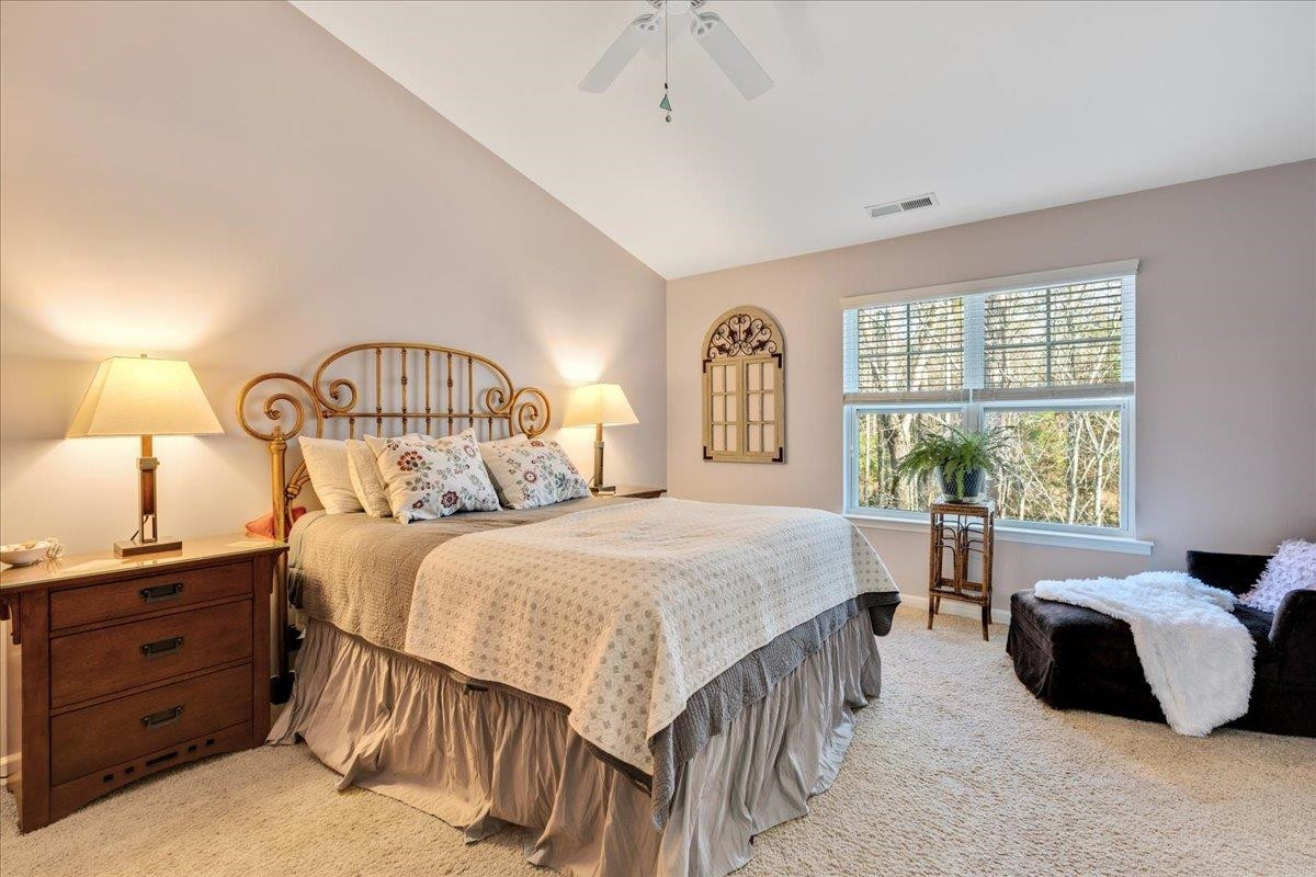 2924 Casona Way Raleigh, NC 27616 - Photo 13 of 21 a bedroom with a bed and a window