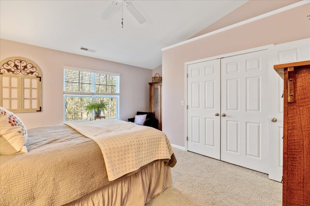 2924 Casona Way Raleigh, NC 27616 - Photo 14 of 21 a bedroom with a bed and a window
