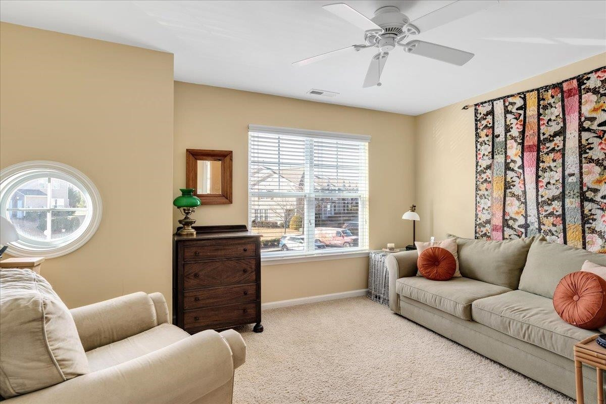 2924 Casona Way Raleigh, NC 27616 - Photo 16 of 21 a living room with furniture and a large window