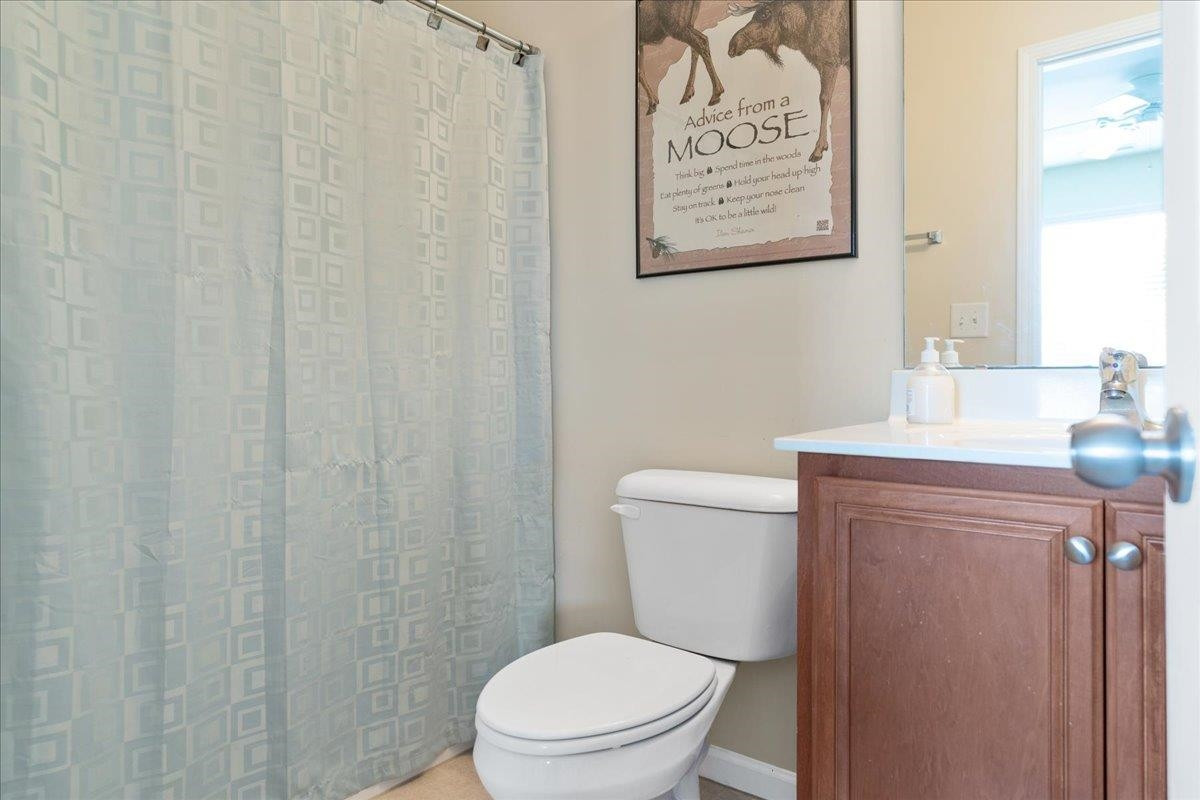2924 Casona Way Raleigh, NC 27616 - Photo 17 of 21 a white toilet sitting next to a bathroom sink