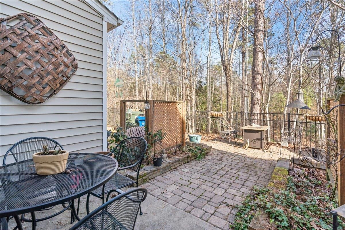 2924 Casona Way Raleigh, NC 27616 - Photo 19 of 21 a backyard of a house with table and chairs