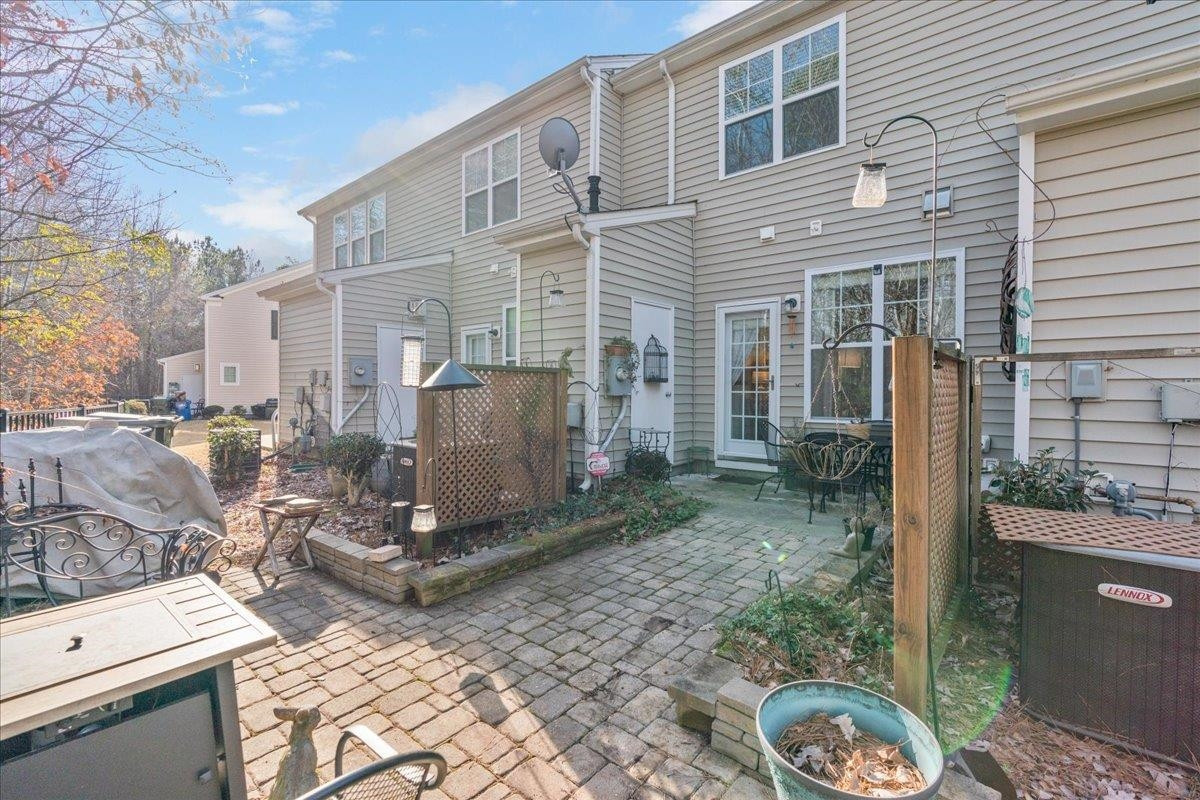 2924 Casona Way Raleigh, NC 27616 - Photo 20 of 21 a view of a patio with table and chairs and potted plants