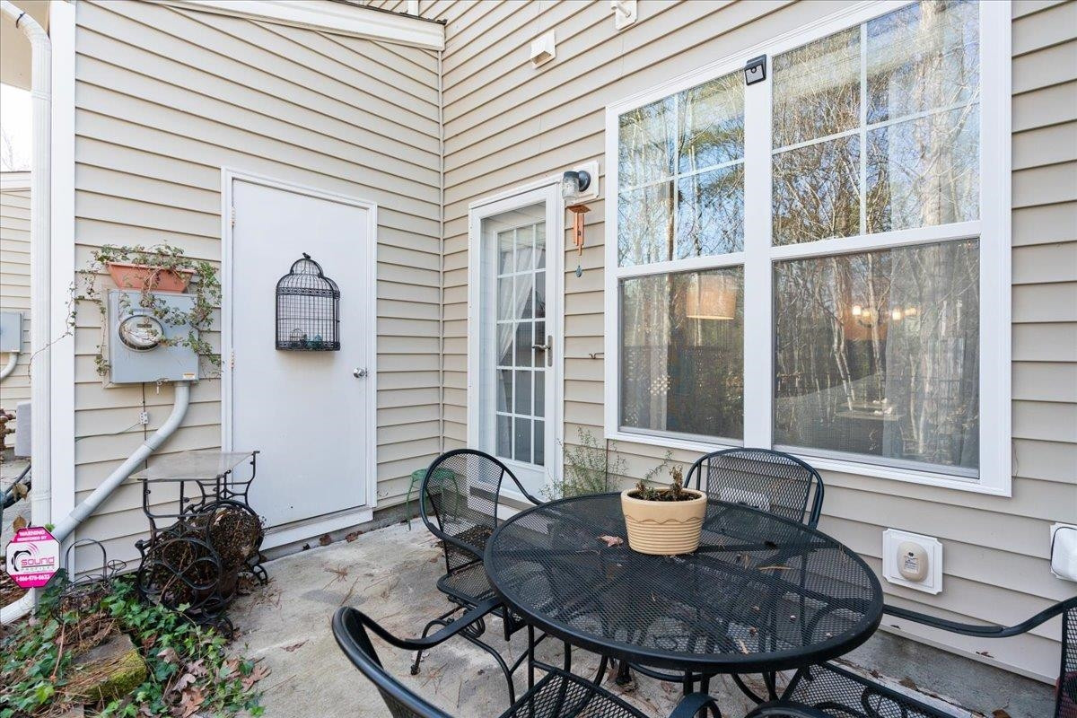 2924 Casona Way Raleigh, NC 27616 - Photo 21 of 21 a view of a dining room with furniture window and wooden floor