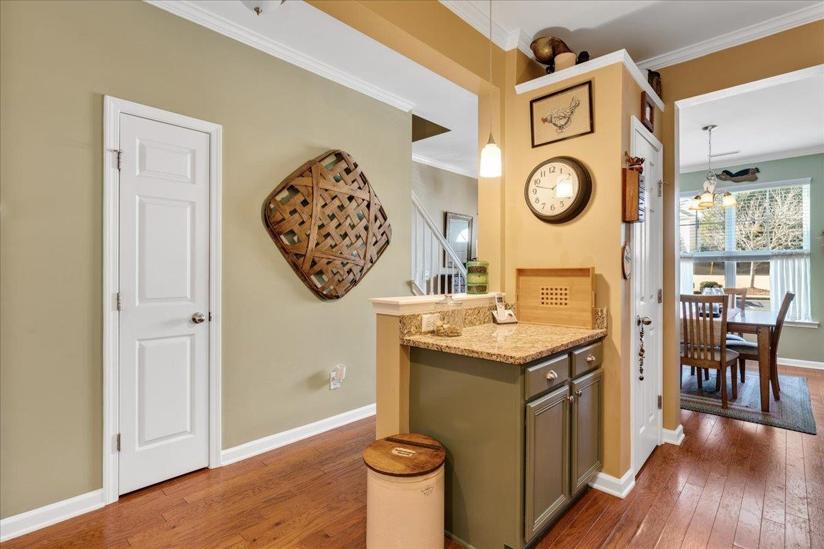 2924 Casona Way Raleigh, NC 27616 - Photo 7 of 21 a view of a kitchen with a table and a clock