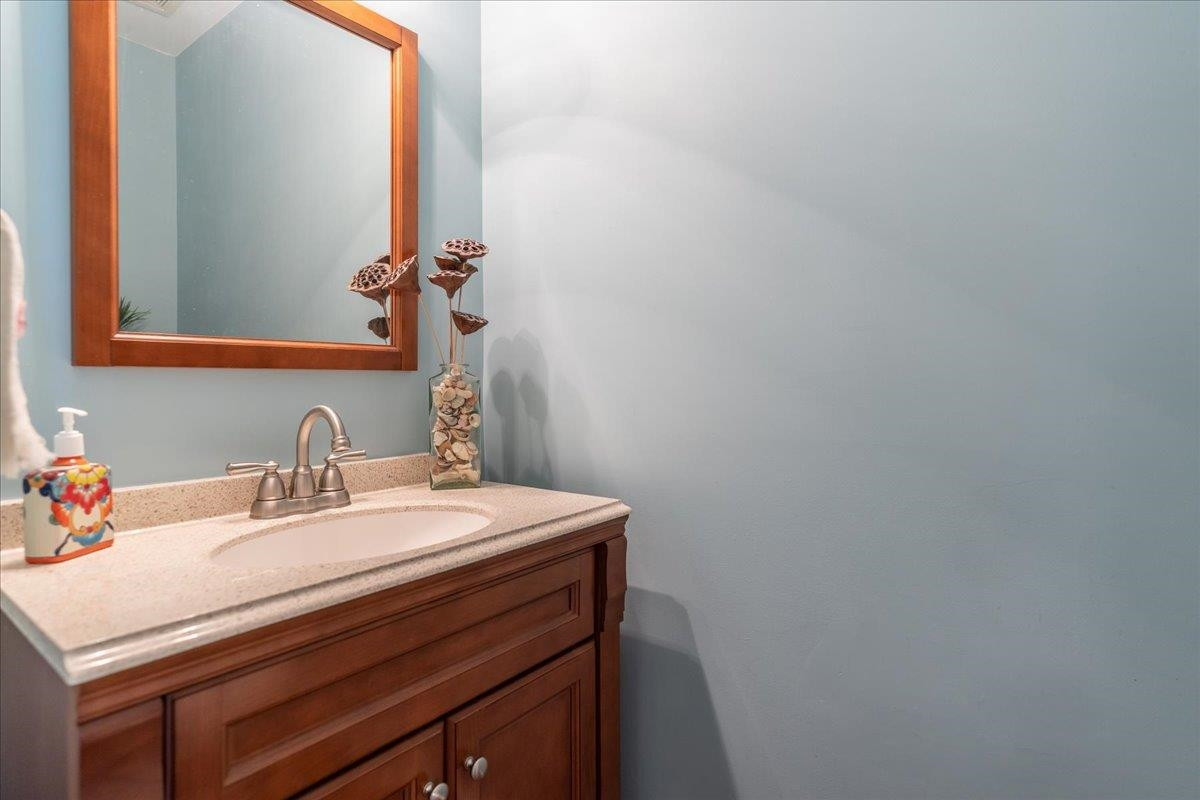 2924 Casona Way Raleigh, NC 27616 - Photo 9 of 21 a bathroom with a sink and a mirror