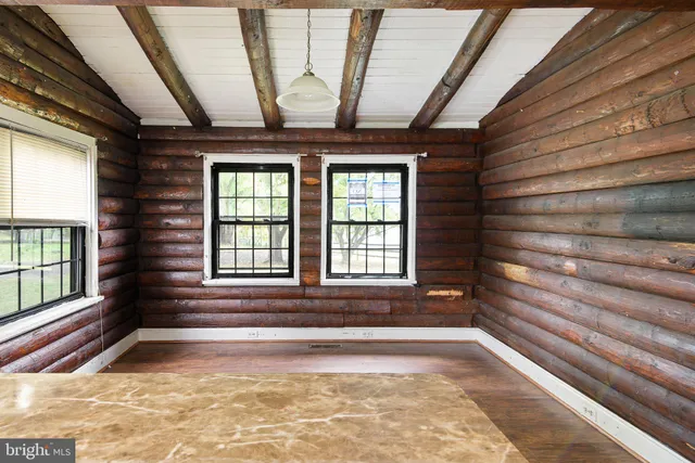 a view of an entryway door with a rug