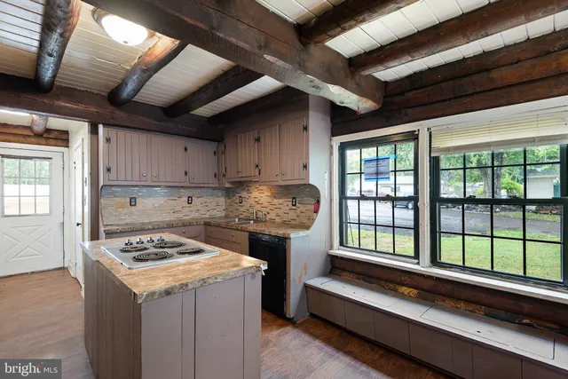 a kitchen that has a sink and a stove