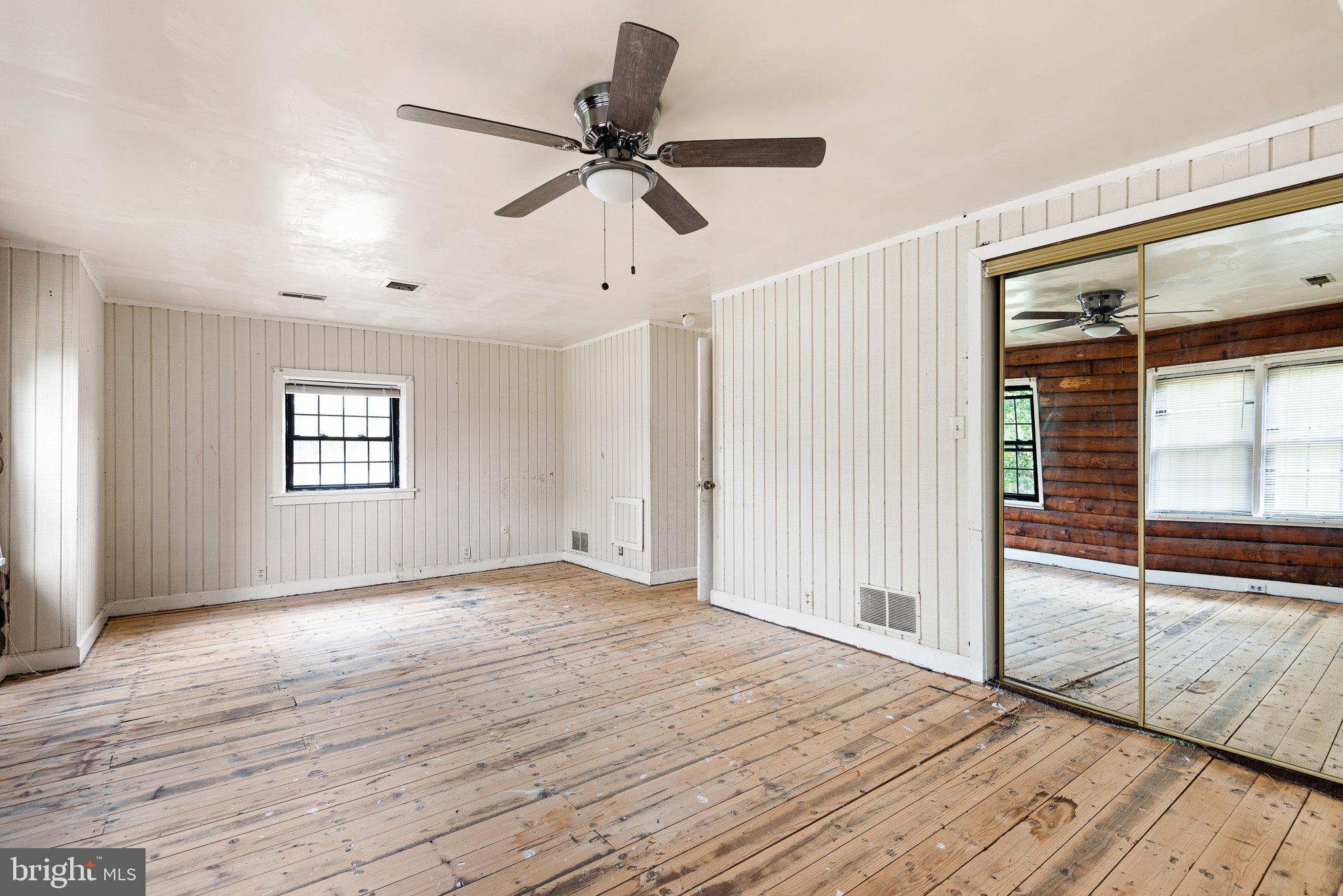 241 Smalleys Dam Road Newark, DE 19702 - Photo 2 of 19 a view of empty room with wooden floor and fan