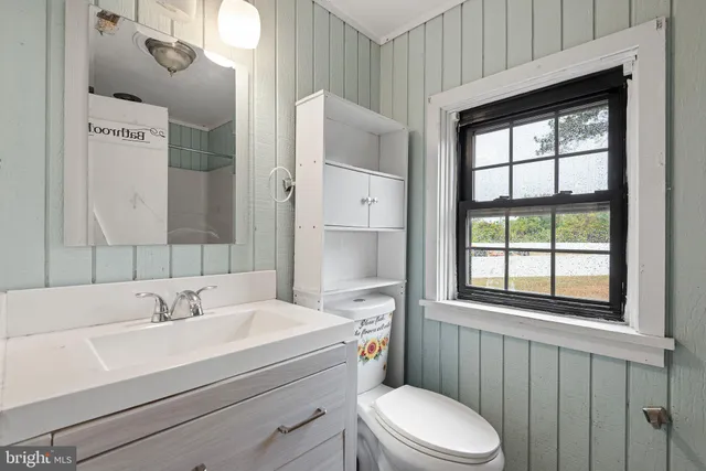 a bathroom with a sink a toilet and tub