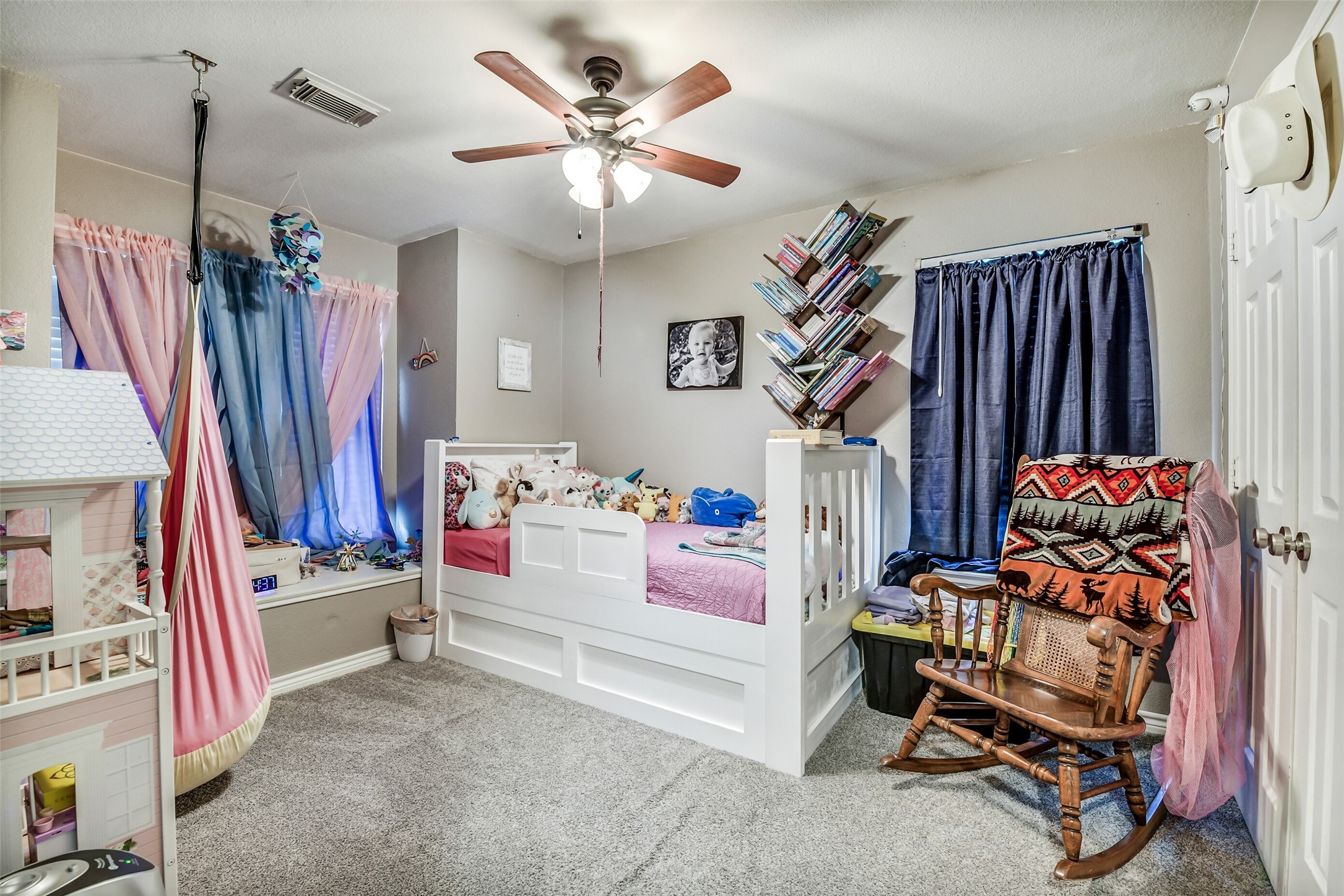 6407 Misty Brook Bend Court Spring, TX 77379 - Photo 11 of 15 a bedroom with furniture and a chandelier