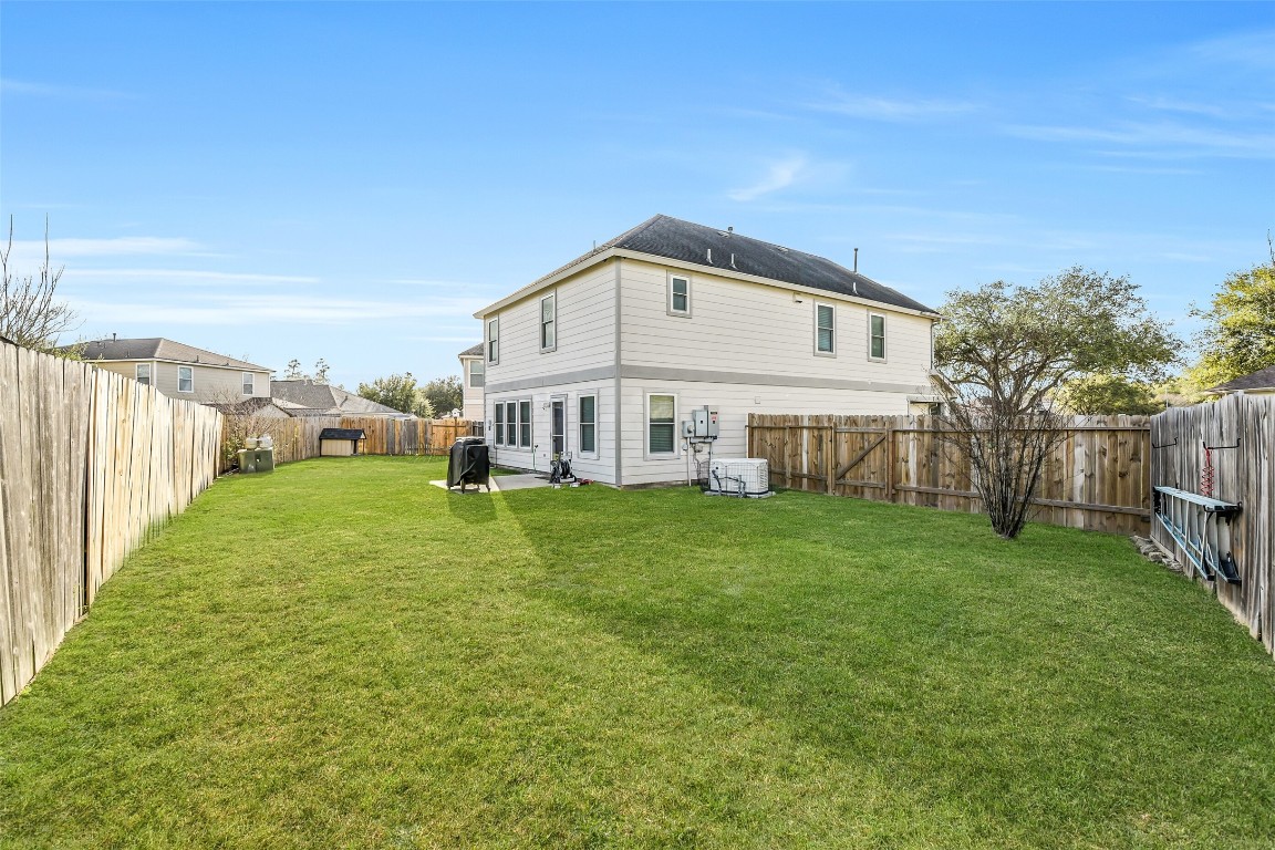 6407 Misty Brook Bend Court Spring, TX 77379 - Photo 14 of 15 a view of a house with backyard and garden