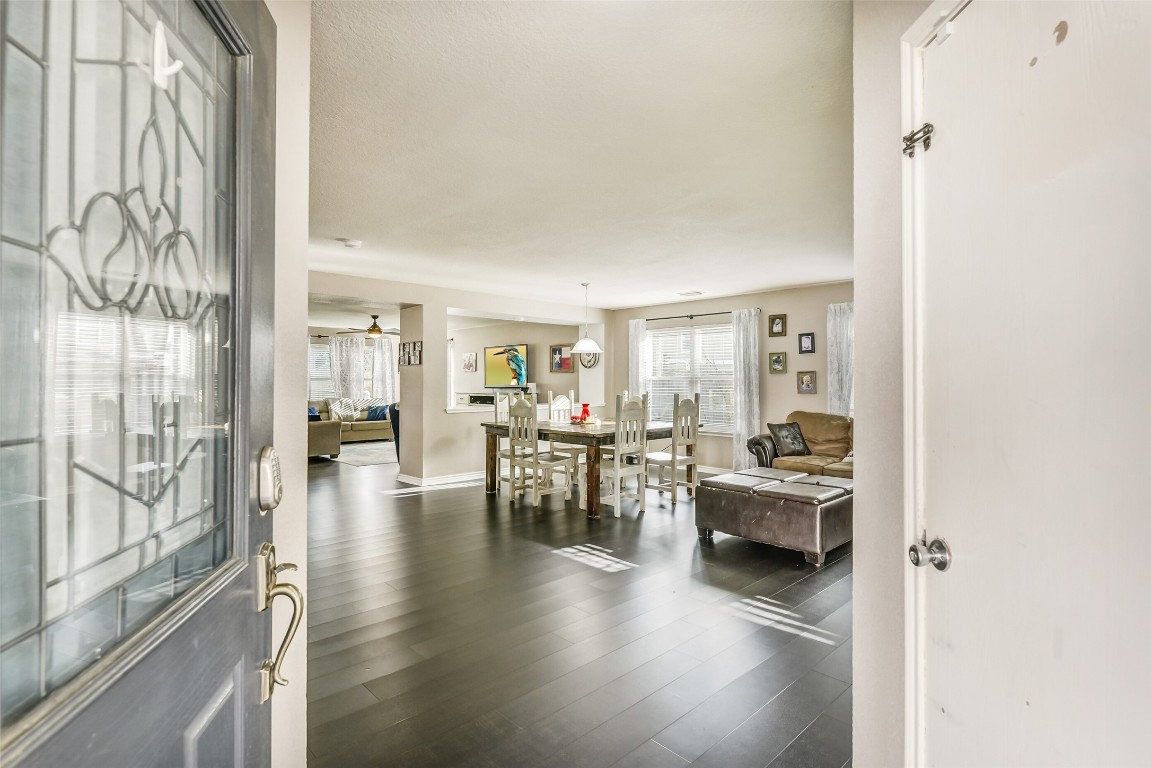6407 Misty Brook Bend Court Spring, TX 77379 - Photo 3 of 15 a living room with fireplace furniture and floor to ceiling window