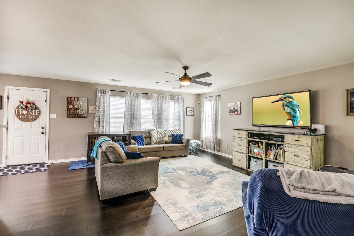 6407 Misty Brook Bend Court Spring, TX 77379 - Photo 7 of 15 a living room with furniture and a flat screen tv
