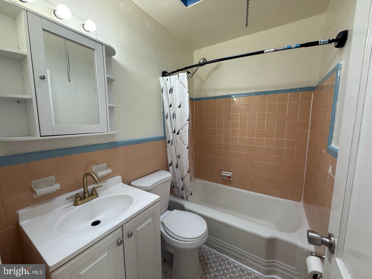 1243 Hellerman Street Philadelphia, PA 19111 - Photo 12 of 20 a bathroom with a sink mirror toilet and shower