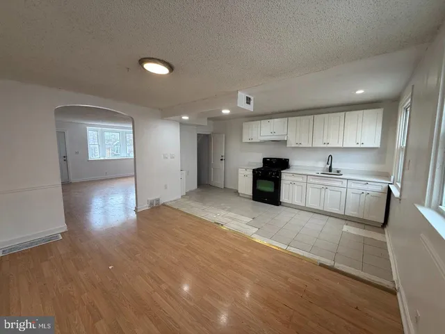 a view of kitchen with wooden floor