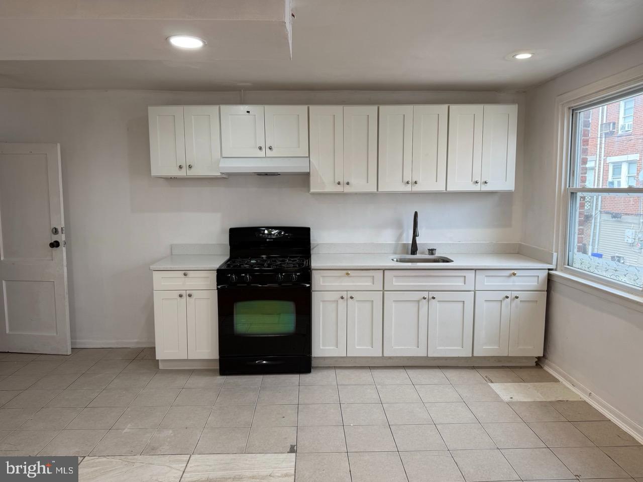 1243 Hellerman Street Philadelphia, PA 19111 - Photo 7 of 20 a kitchen with cabinets and appliances