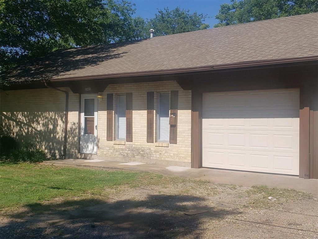 a house with yard in front of it