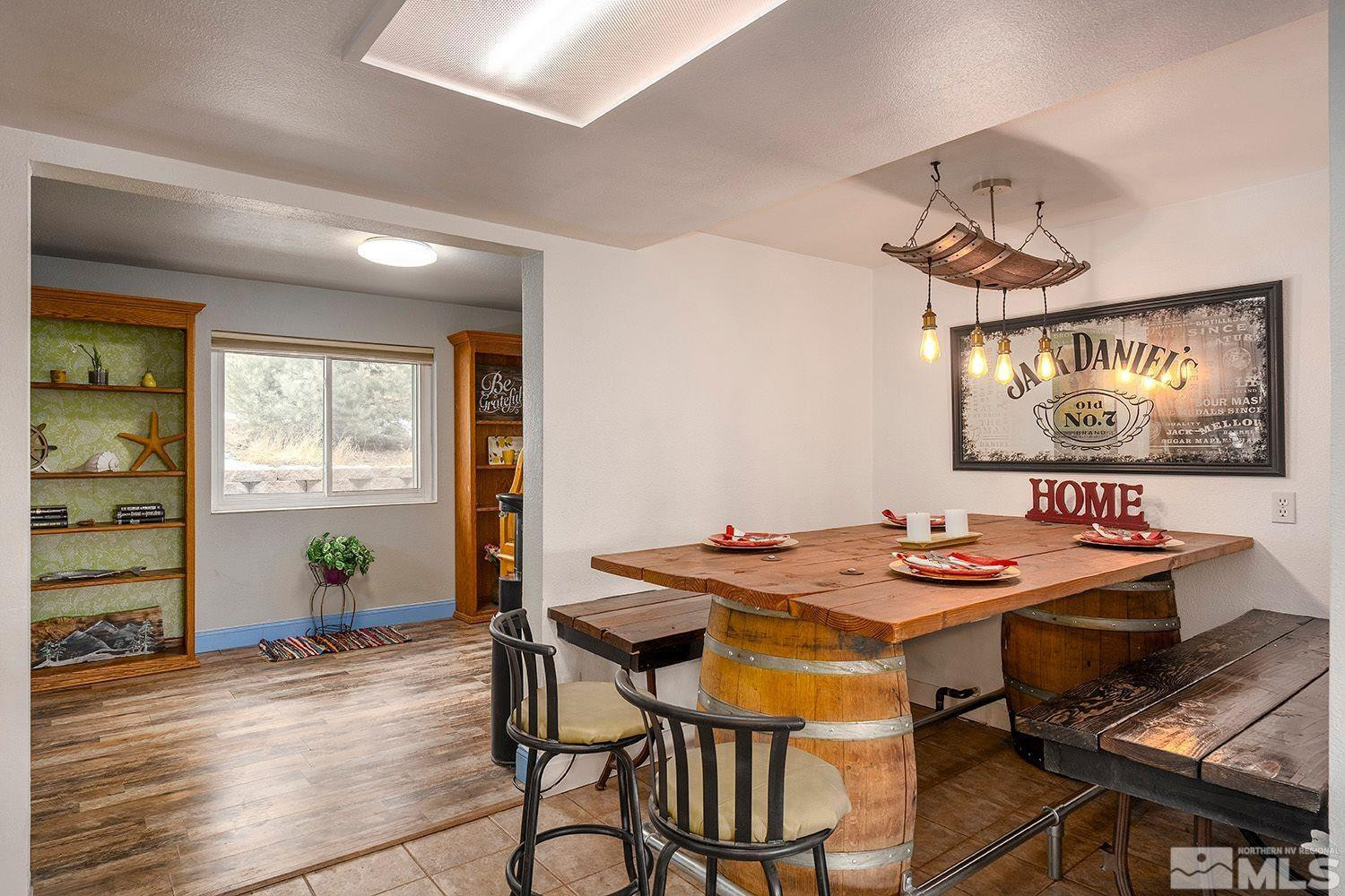 1880 Castle Peak Road Reno, NV 89521 - Photo 13 of 27 a view of a dining room with furniture and wooden floor