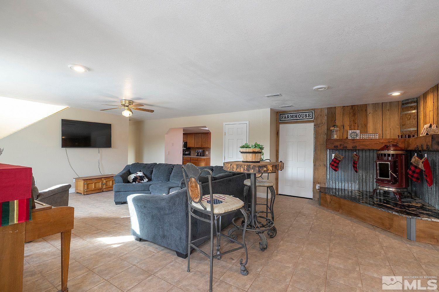 1880 Castle Peak Road Reno, NV 89521 - Photo 7 of 27 a living room with furniture and a flat screen tv