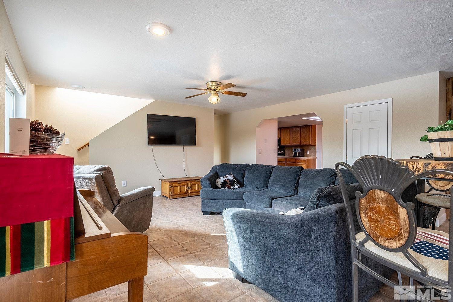 1880 Castle Peak Road Reno, NV 89521 - Photo 8 of 27 a living room with furniture and a flat screen tv