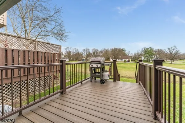 a view of wooden deck with a patio