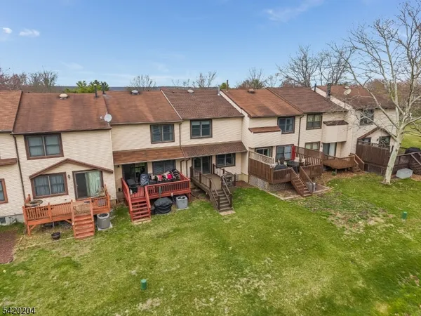 an aerial view of a house with a garden and plants