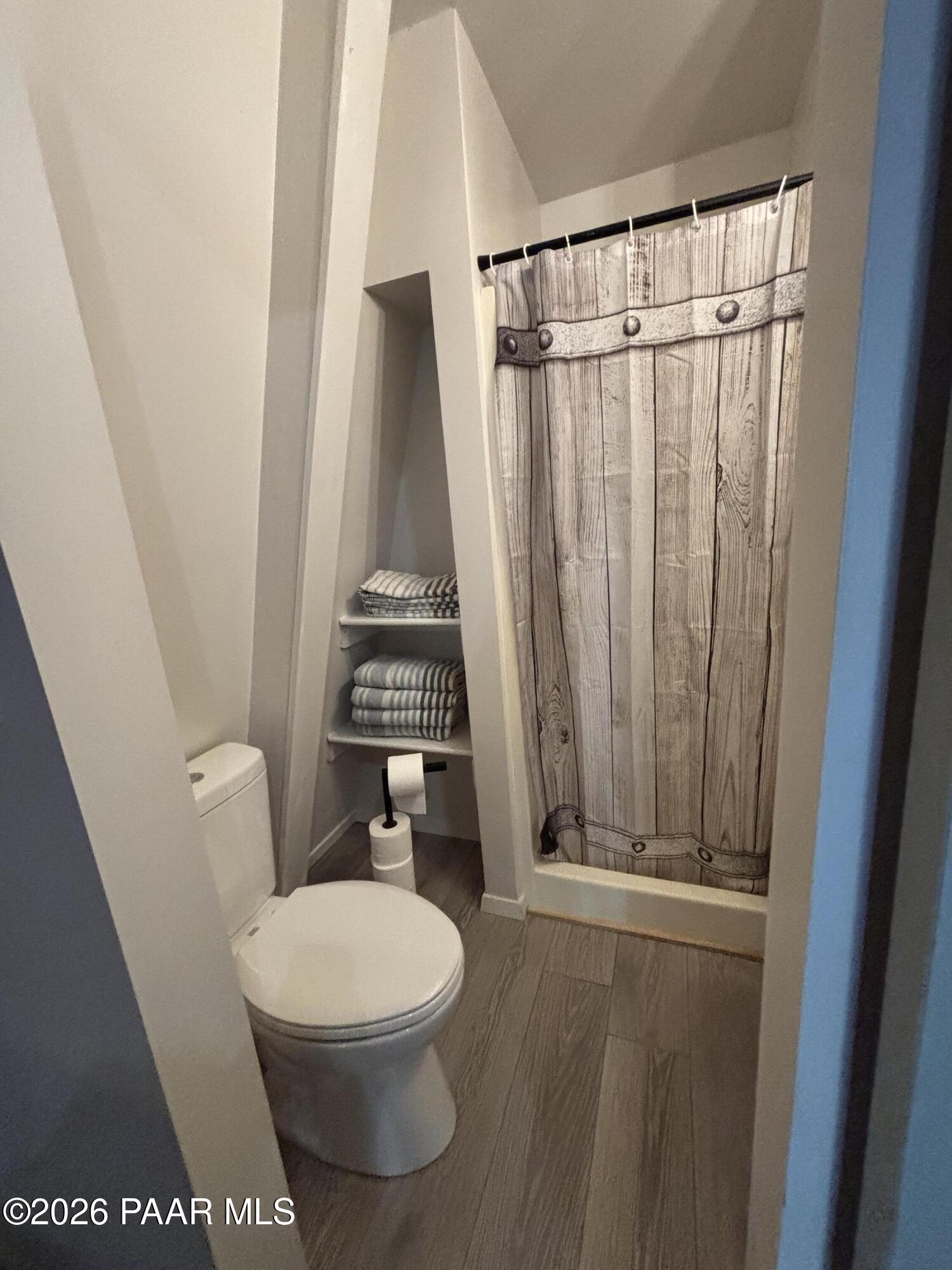 8550 South Breezy Pine Road Mayer, AZ 86333 - Photo 30 of 40 a bathroom with a toilet and a shower