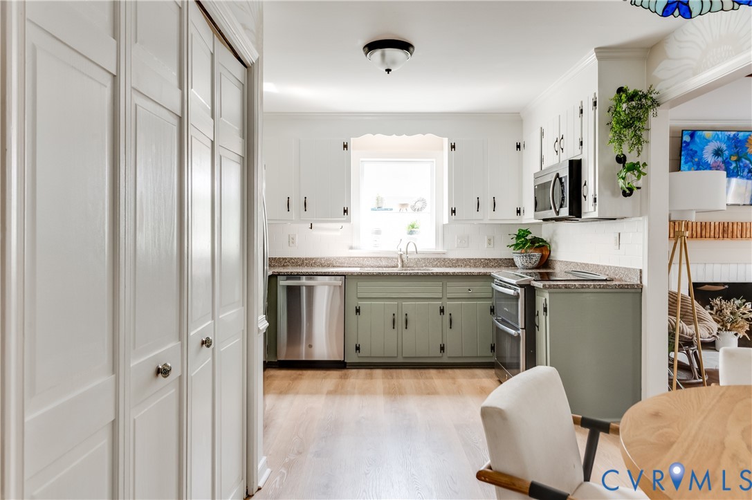 1318 Unison Drive Midlothian, VA 23113 - Photo 15 of 47 a kitchen with a sink refrigerator and cabinets