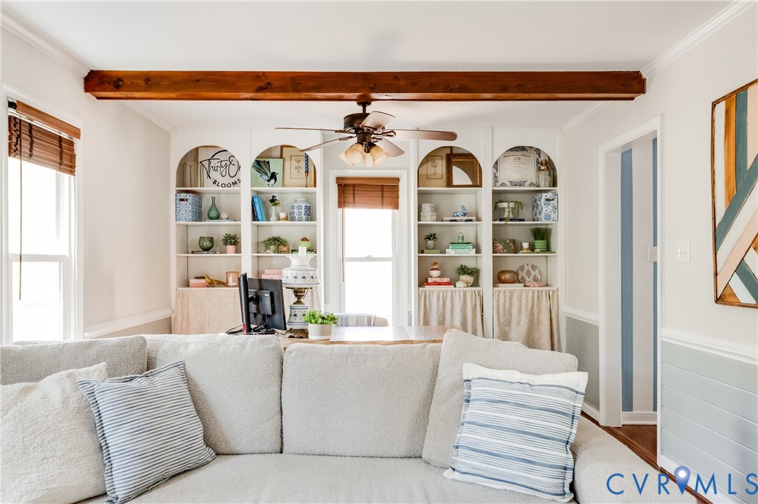 1318 Unison Drive Midlothian, VA 23113 - Photo 28 of 47 a living room with couches a fireplace and a large window with garden view