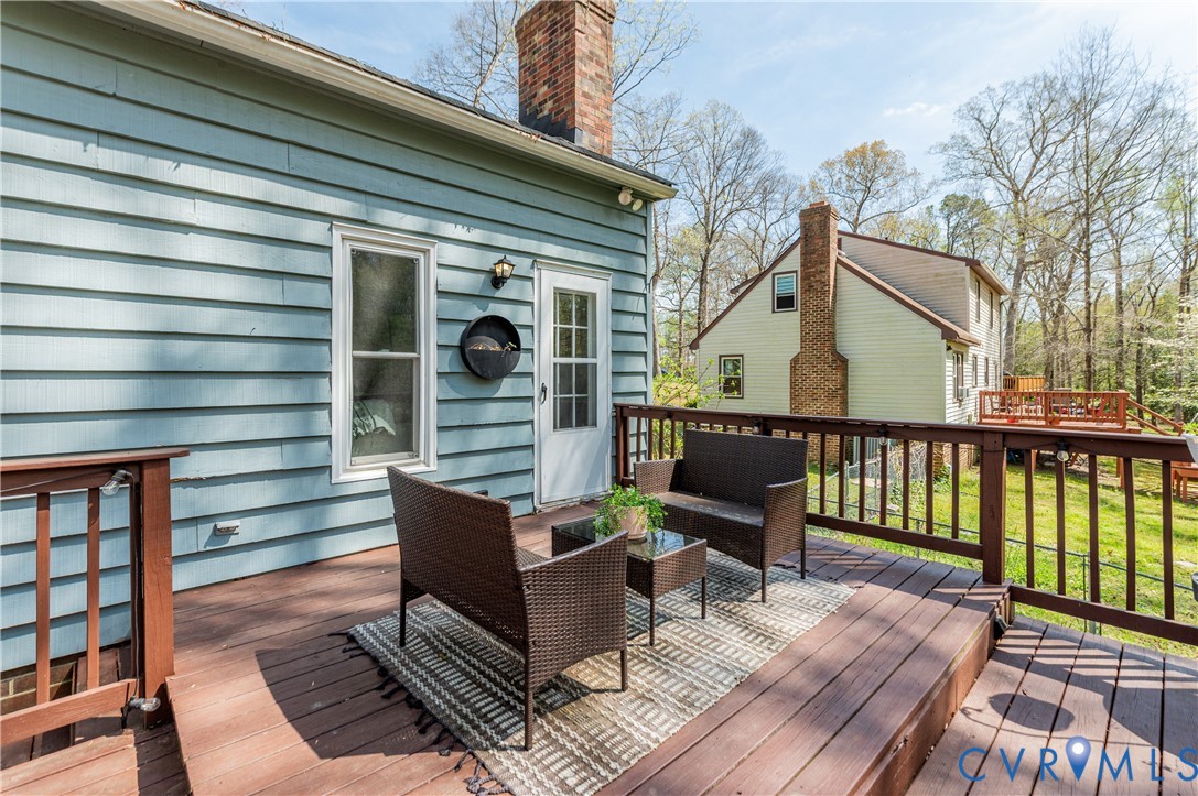 1318 Unison Drive Midlothian, VA 23113 - Photo 38 of 47 a view of a deck with wooden floor and furniture