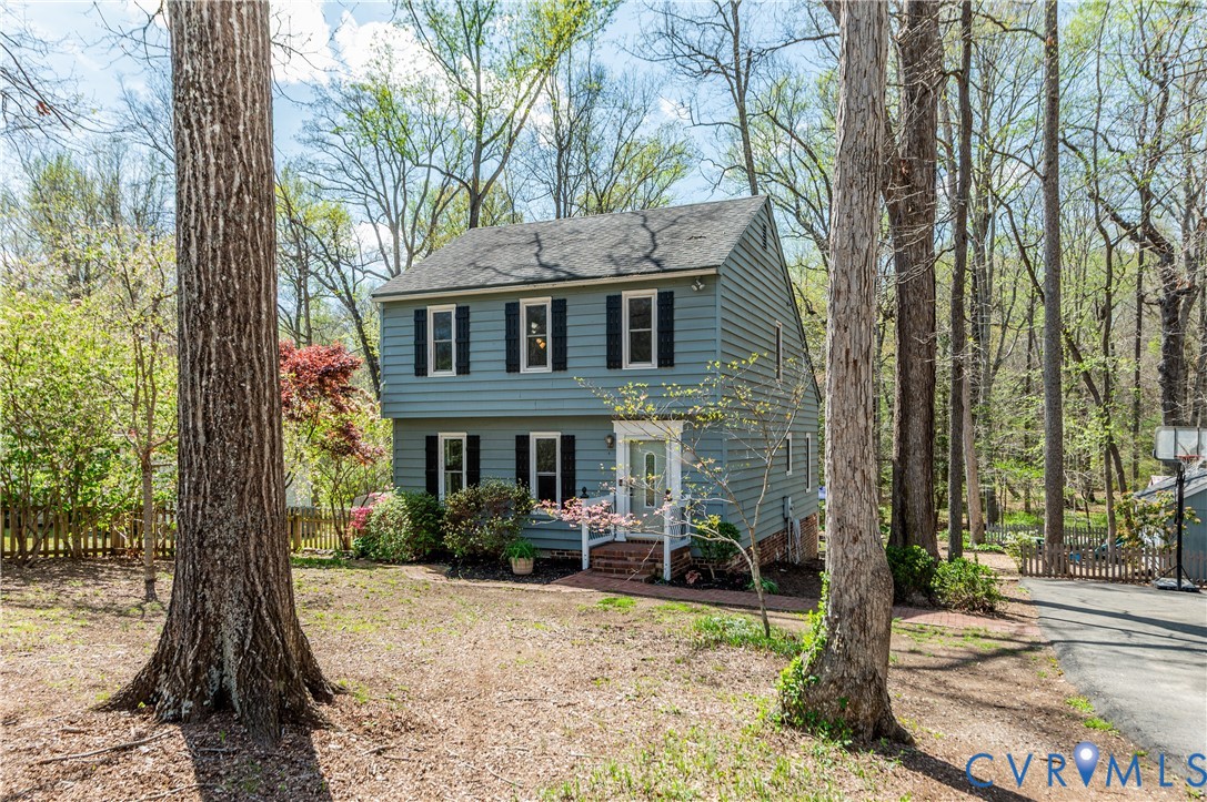 1318 Unison Drive Midlothian, VA 23113 - Photo 4 of 47 a front view of a house with a yard