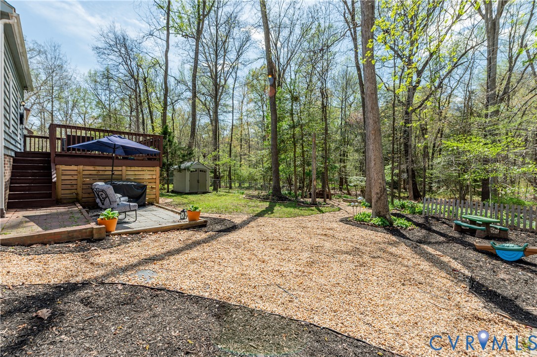 1318 Unison Drive Midlothian, VA 23113 - Photo 41 of 47 a view of a backyard with a tree