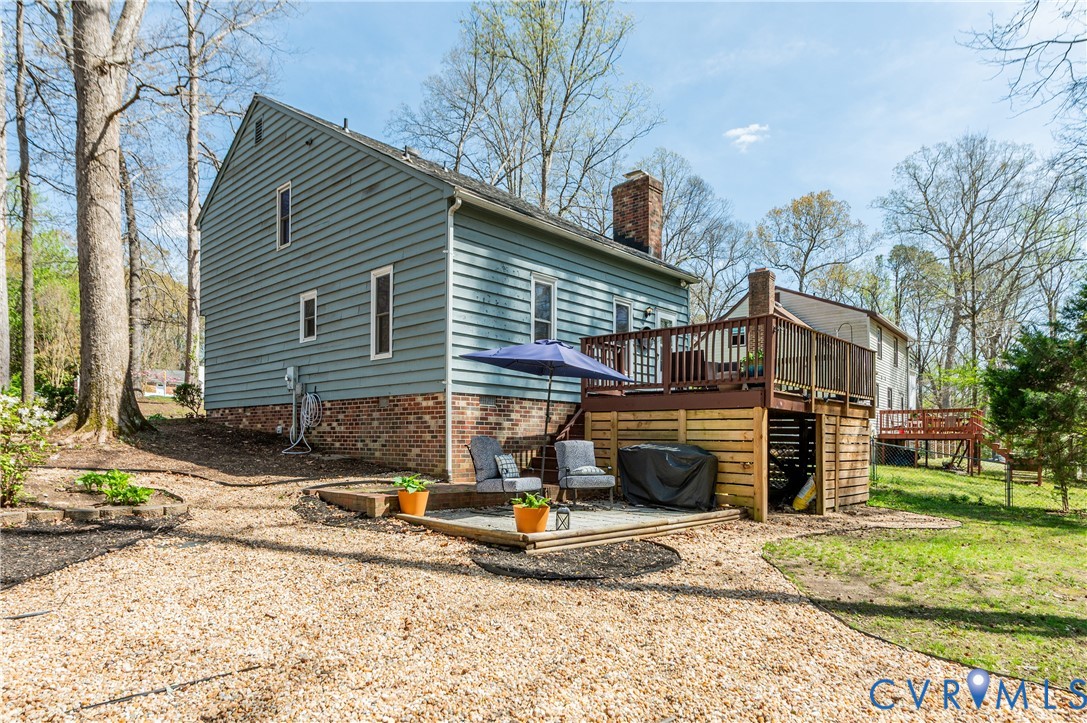 1318 Unison Drive Midlothian, VA 23113 - Photo 42 of 47 a view of a house with a yard and a fire pit