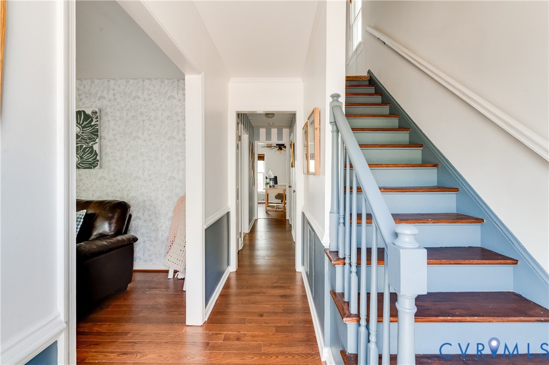 1318 Unison Drive Midlothian, VA 23113 - Photo 7 of 47 a view of a hallway with wooden floor and staircase